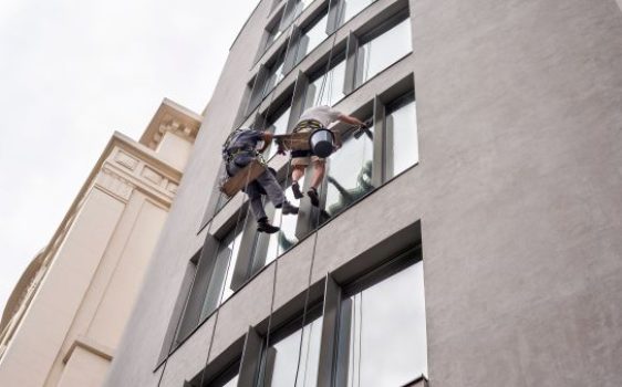 Technicians performing high-rise window cleaning in Waterford