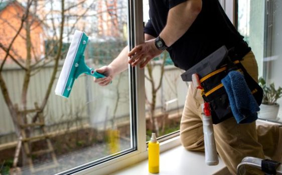 Professional cleaning both interior and exterior windows of a home in Waterford